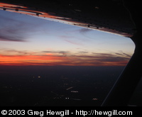 Sunset out the right window from the air.