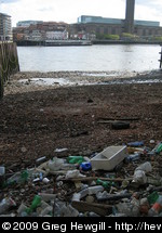 Rubbish washed up on the shore of the Thames