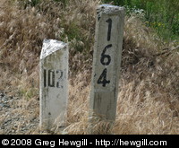 Most of the mile markers (white) had already been removed and replaced with km markers, but this one remains