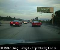 Heading toward dinner after a great day of canyonballing! (The red NSX on the left of this picture looks like it has a big dent in the right rear quarter panel. That's not a dent, I think it's actually the reflection of the freeway sign.)