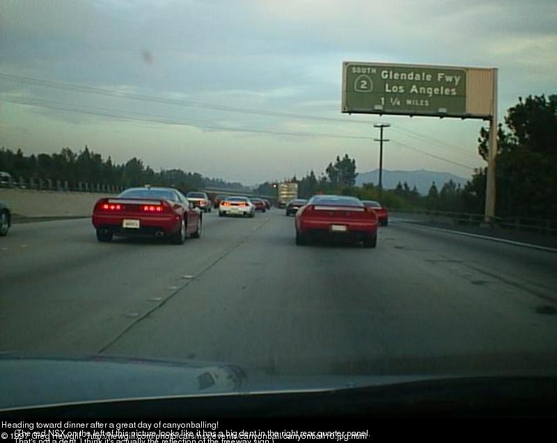 Heading toward dinner after a great day of canyonballing! (The red NSX on the left of this picture looks like it has a big dent in the right rear quarter panel. That's not a dent, I think it's actually the reflection of the freeway sign.)
