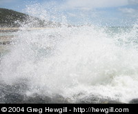 Wave crashing over the Champagne Pools
