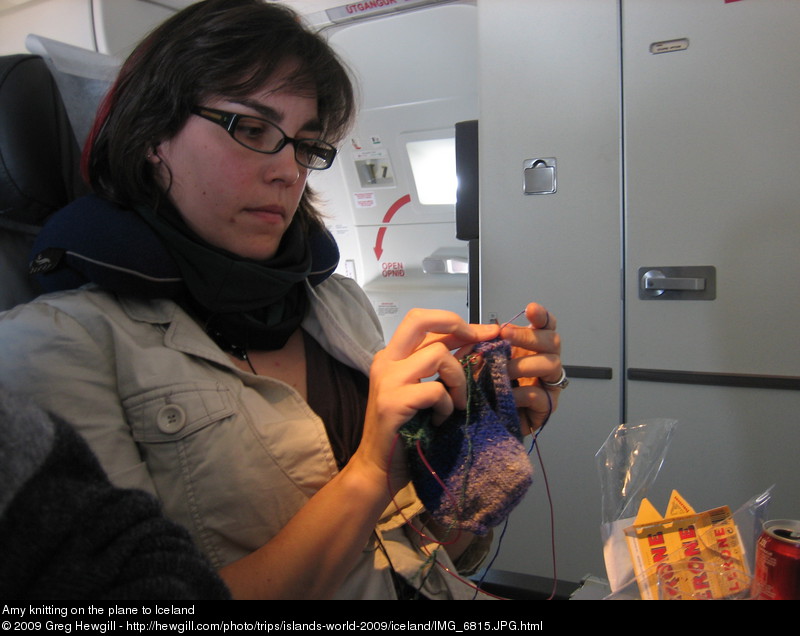 Amy knitting on the plane to Iceland