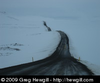 Road disappearing off into the snowy distance