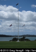 Flagpole with New Zealand at top, Maori on left, Union Jack on right