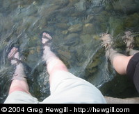 Our feet in the river in Sort.