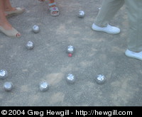 The object is to end up with your silver ball closest to the small red one.