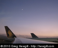 Sliver of moon over the airport at San Francisco